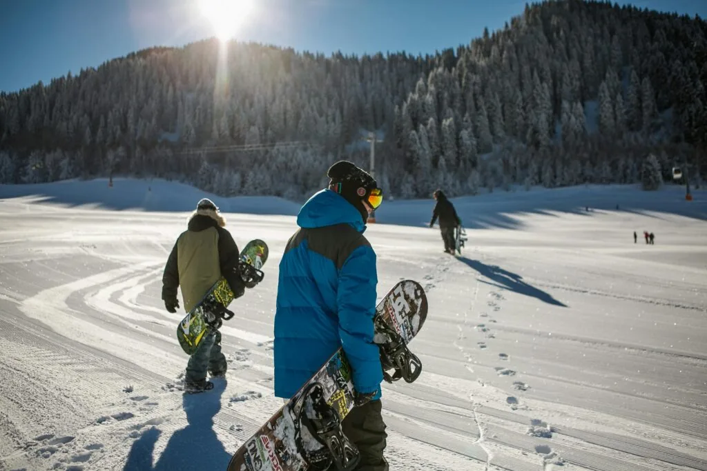 Snow-covered mountain ski resort at golden hour