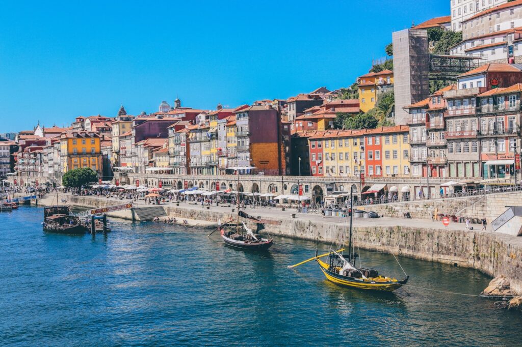 Porto old town rooftops and the Douro river at golden hour