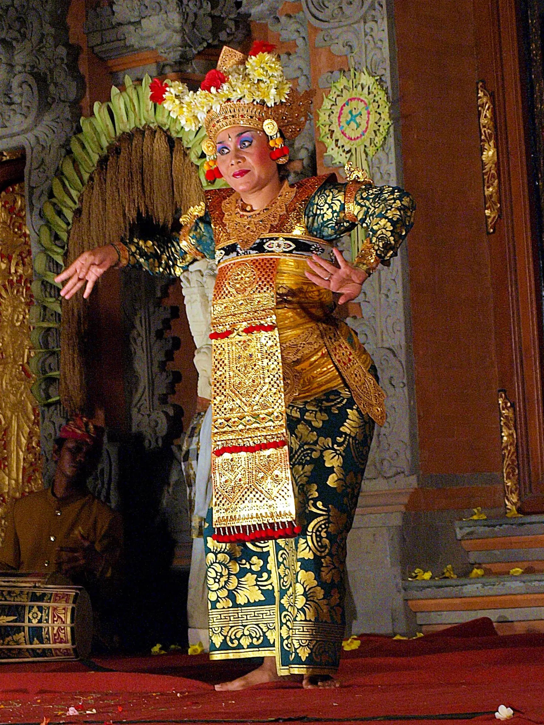 Legong dancers in traditional Balinese costume performing in Ubud
