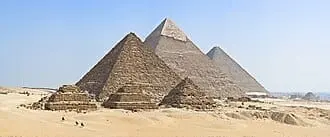 The pyramids of Giza rising from the desert sand near Cairo, Egypt