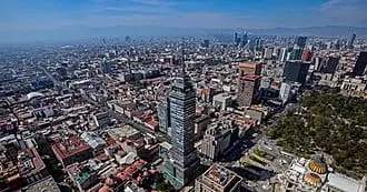Mexico City stretching to the horizon with the Torre Latinoamericana in the foreground