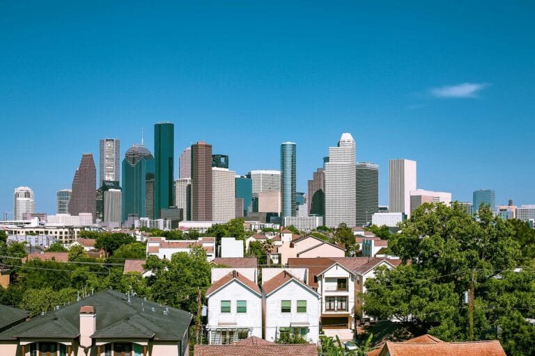 The Houston skyline rising beyond leafy suburbs, Texas