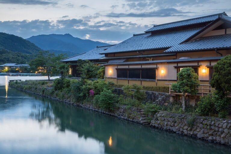 Traditional tiled-roof building beside a canal in Japan