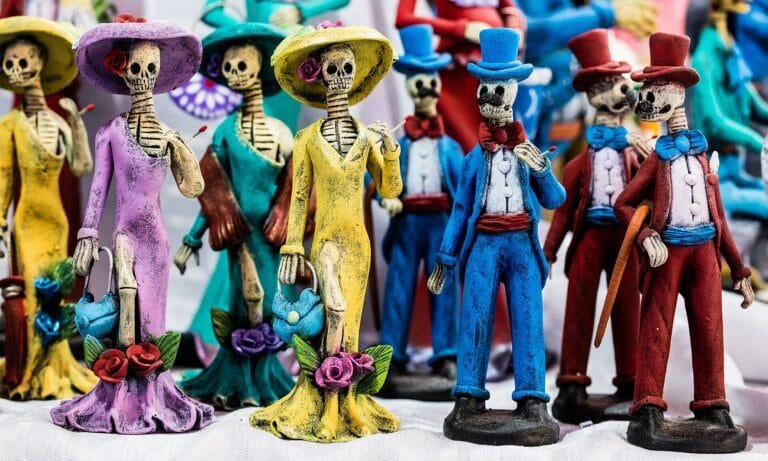Brightly painted Day of the Dead catrina figurines on display in Mexico