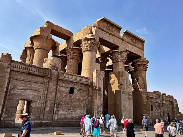 Visitors at the columned entrance of the Temple of Kom Ombo, Egypt