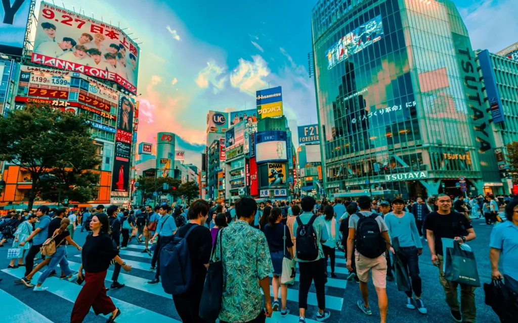Crowds streaming across Shibuya Crossing in Tokyo