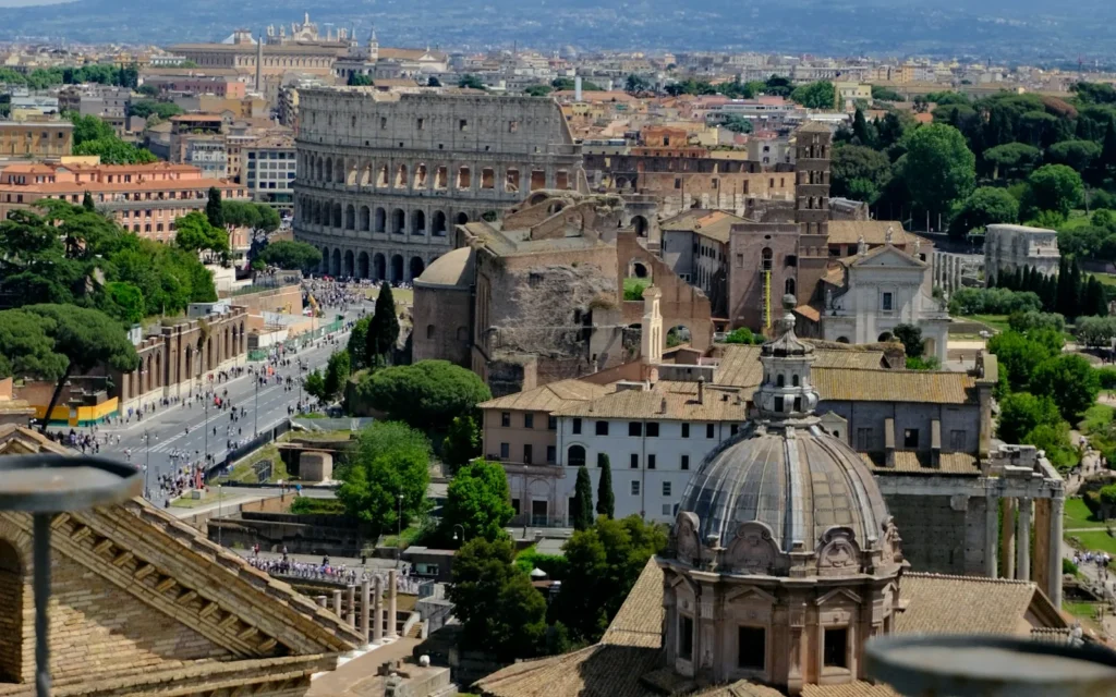 The domes and rooftops of Rome under a blue sky, Italy