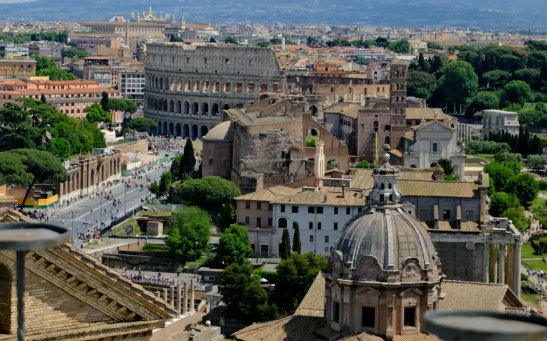 The domes and rooftops of Rome under a blue sky, Italy