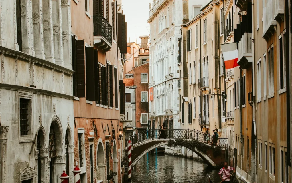 A gondola on a narrow canal in Venice, Italy