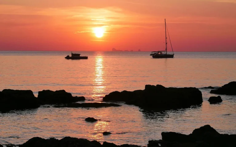 Sunset over moored boats off Koh Lanta, Thailand