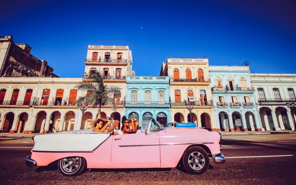 A classic car on a colourful street in Old Havana, Cuba
