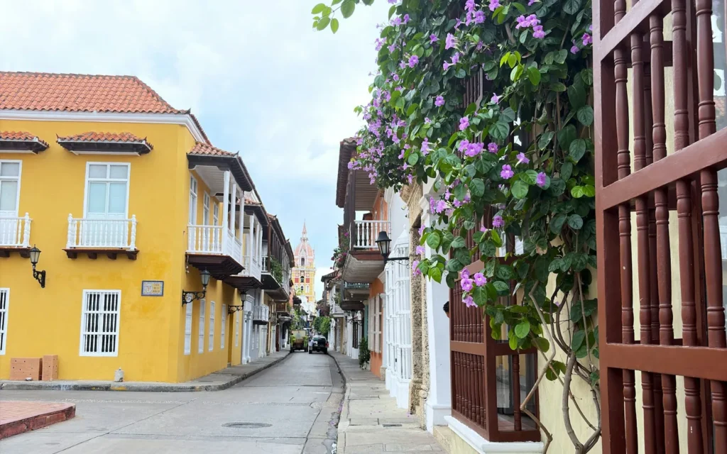 A colonial street of balconies and bougainvillea in Cartagena, Colombia