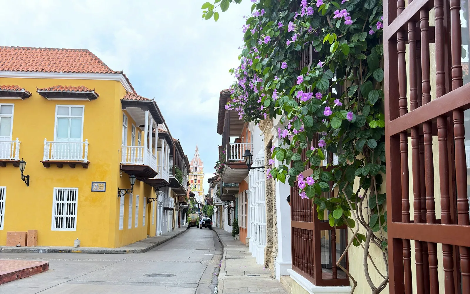 A colonial street of balconies and bougainvillea in Cartagena, Colombia
