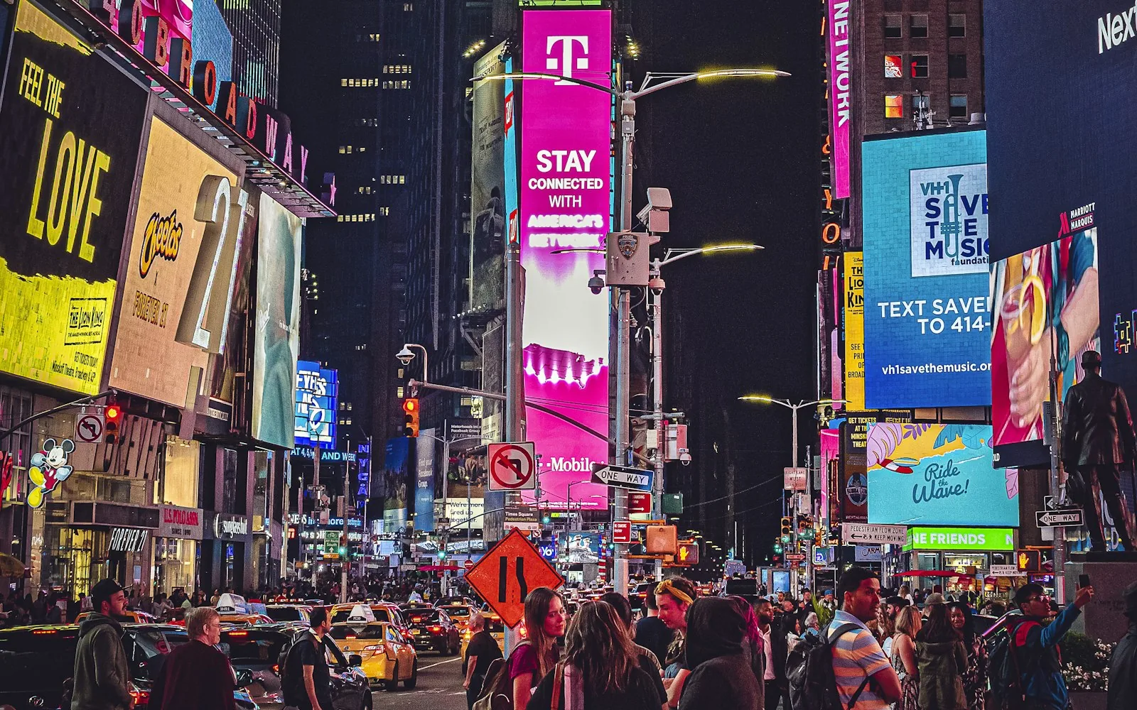 The bright billboards and crowds of Times Square at night, New York City