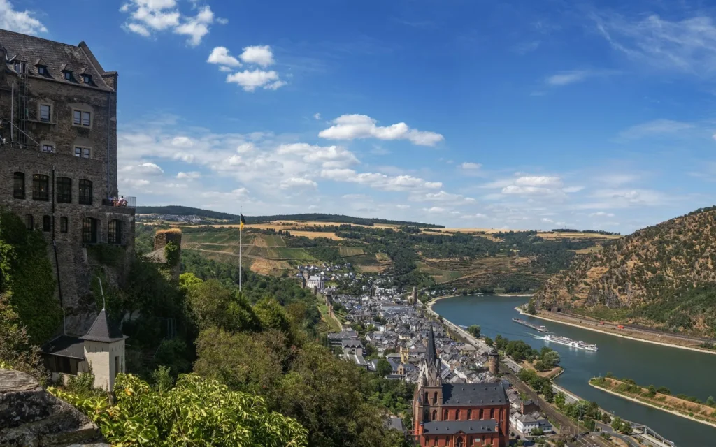 A hilltop castle above the Rhine Gorge and its vineyards, Germany