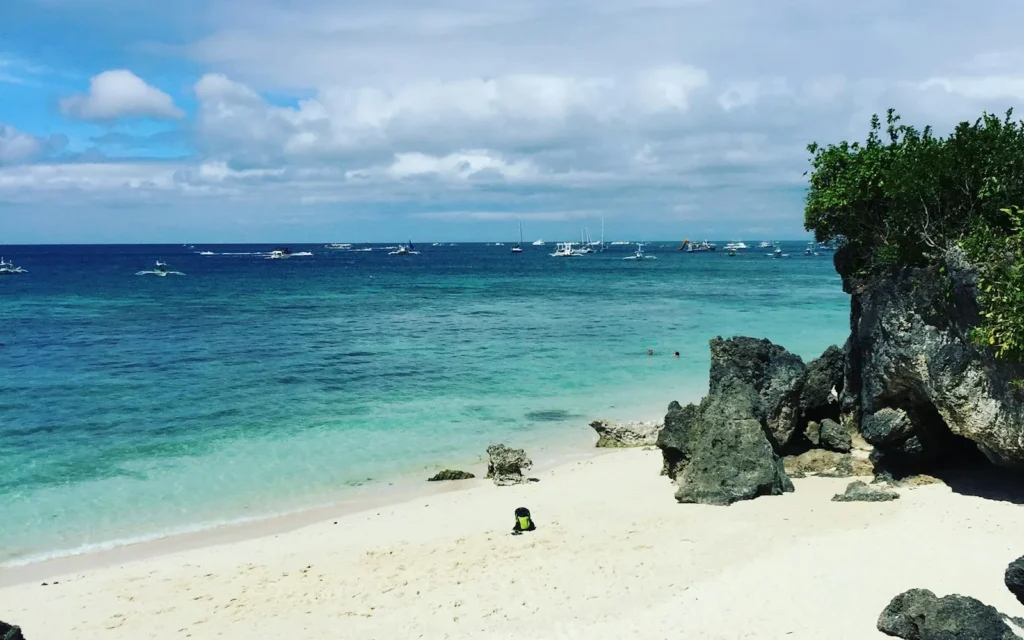 The white sand and clear shallows of Boracay, Philippines