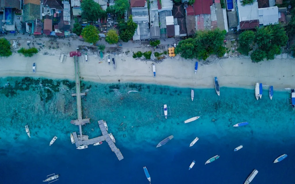 Turquoise water and moored boats off the Gili Islands, Indonesia
