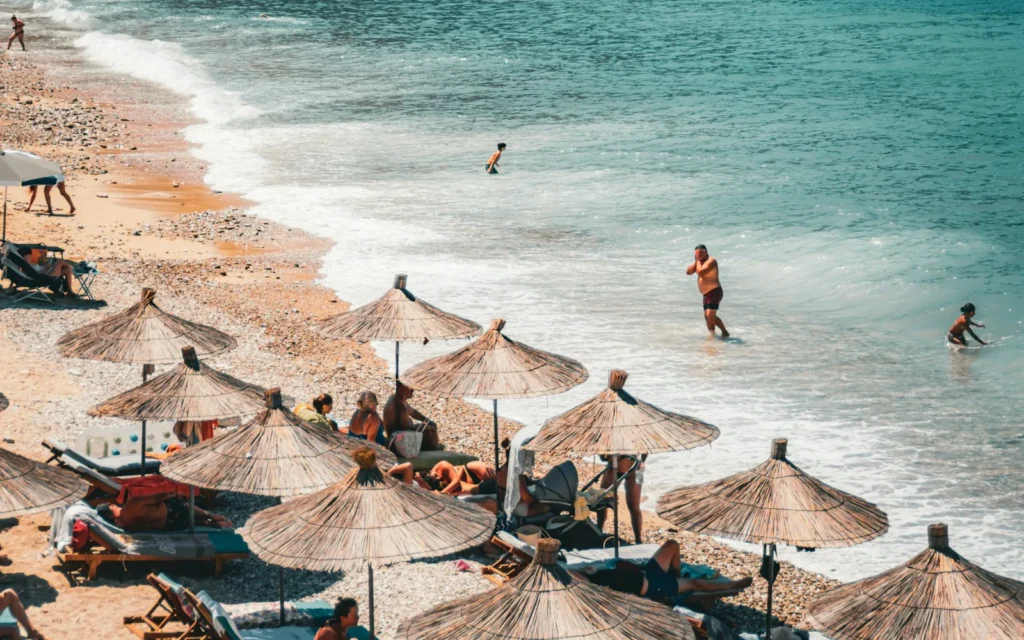 A turquoise beach backed by green cliffs on the Albanian Riviera