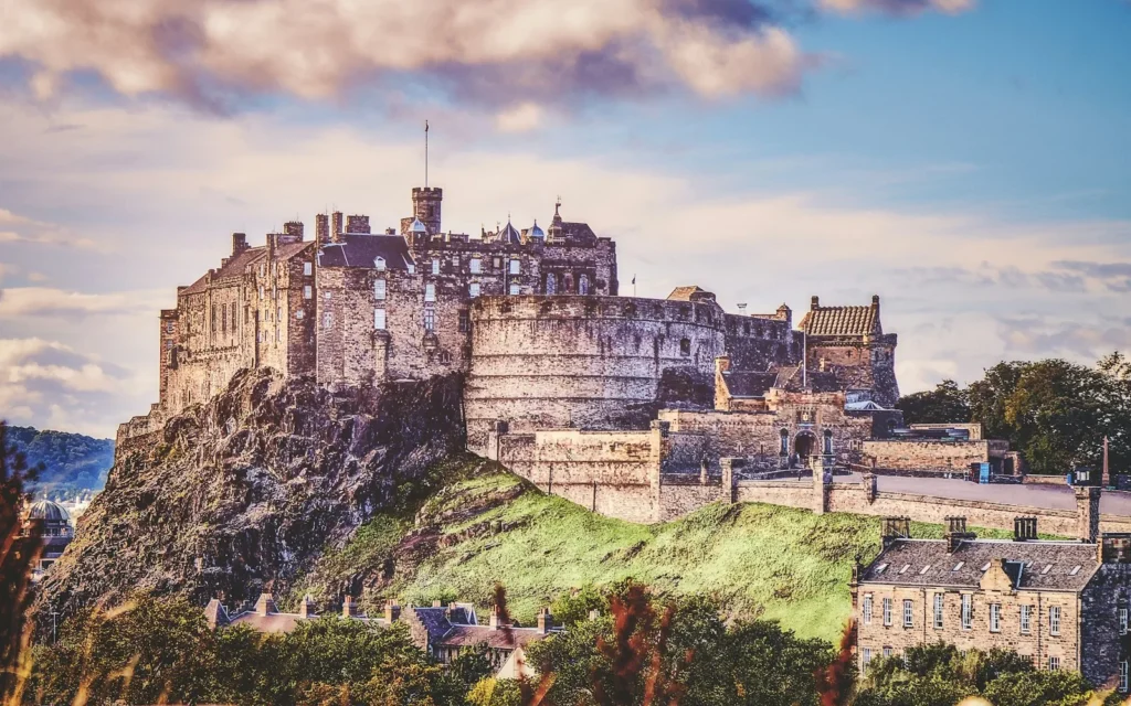 Edinburgh Castle on its volcanic rock at golden hour, Scotland