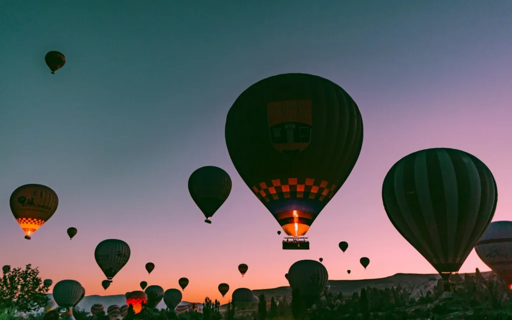 Golden-hour hot-air balloons over the valleys of Cappadocia, Turkey