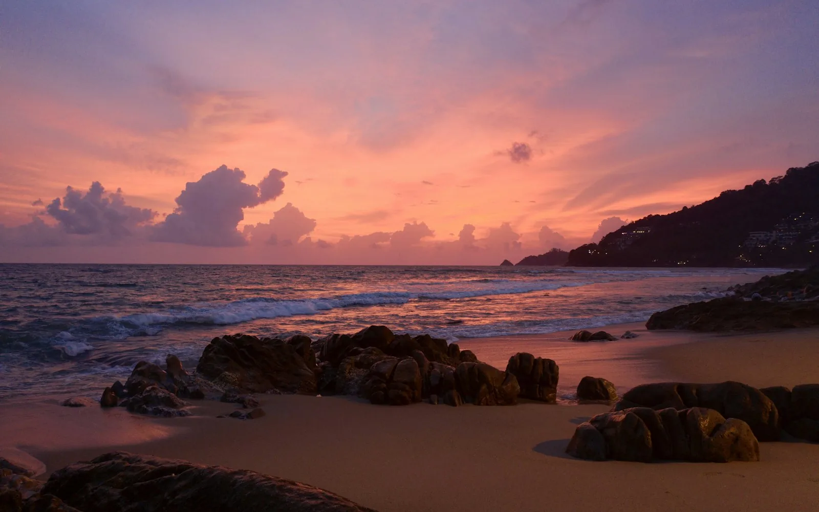 A pink sunset over the rocky cape and sea at Phuket, Thailand