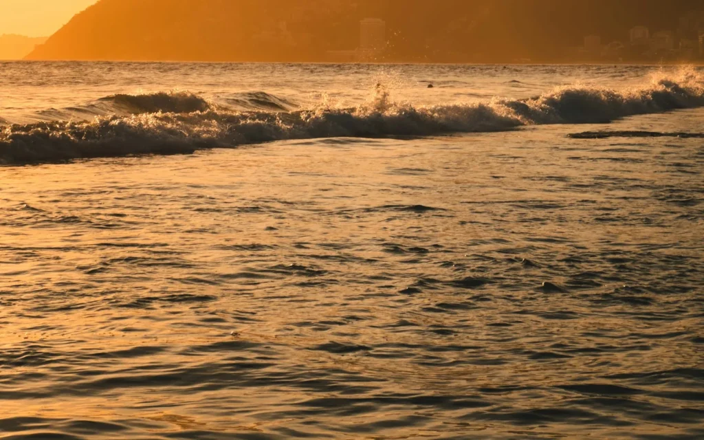 The Two Brothers mountain glowing at sunset over the beach in Rio de Janeiro, Brazil