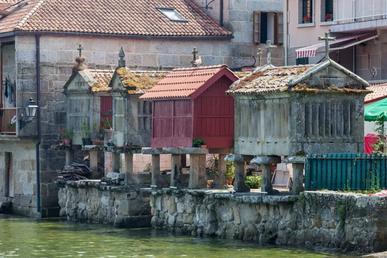 Stone horreo granaries standing over the water at Combarro in Galicia, Spain
