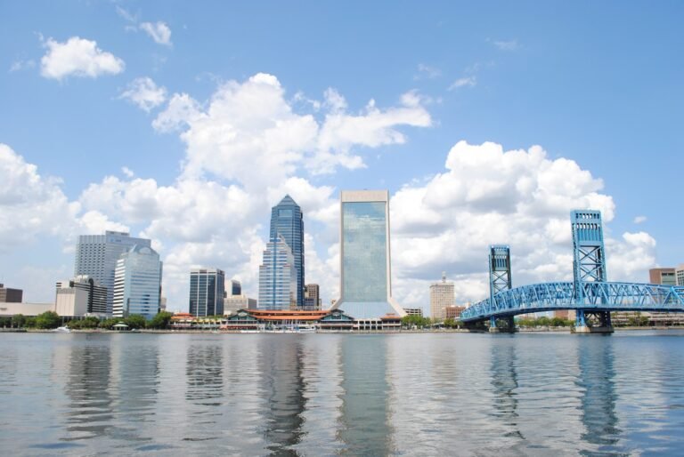 The Jacksonville skyline across the St. Johns River with the blue Main Street Bridge at right