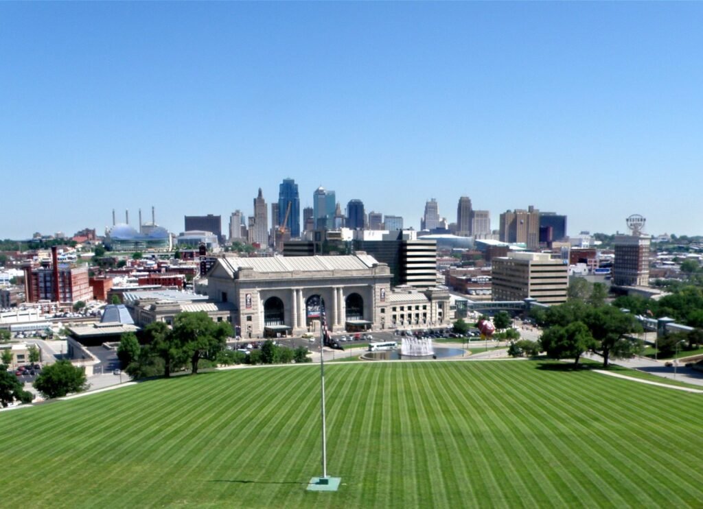 Kansas City’s downtown skyline rising behind Union Station and the long green lawn below the Liberty Memorial