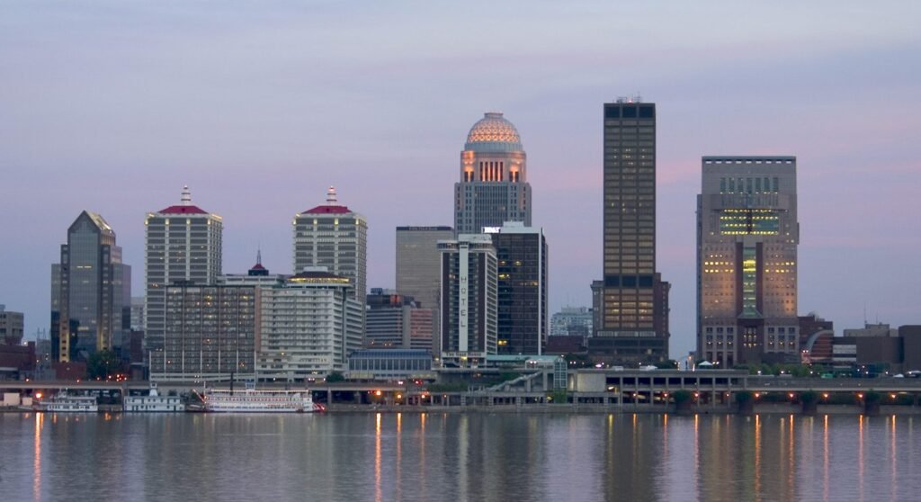 The downtown Louisville skyline seen across the Ohio River at dusk