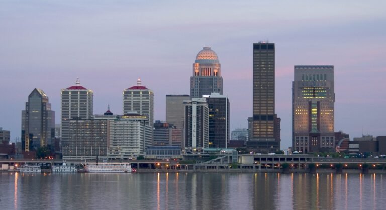 The downtown Louisville skyline seen across the Ohio River at dusk