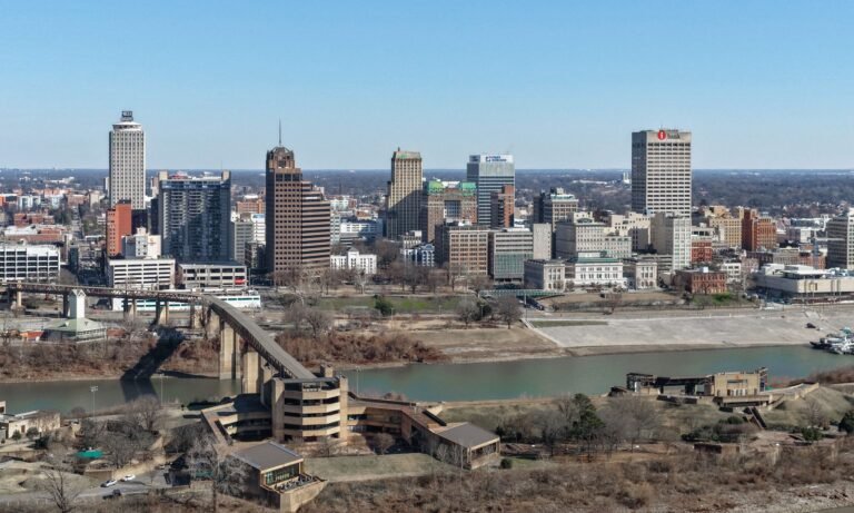 The Memphis skyline above the Mississippi River with the old bridge approach in the foreground