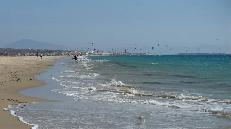 Kitesurfers off the long sandy beach at Tarifa in Cadiz province, southern Spain